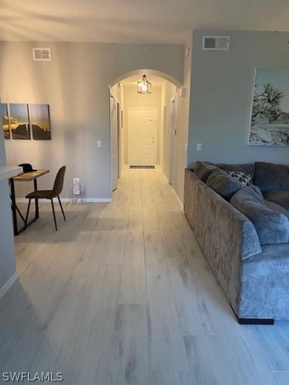 hallway with light wood-type flooring