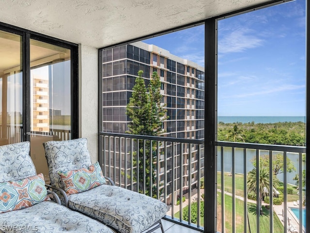 balcony featuring a water view