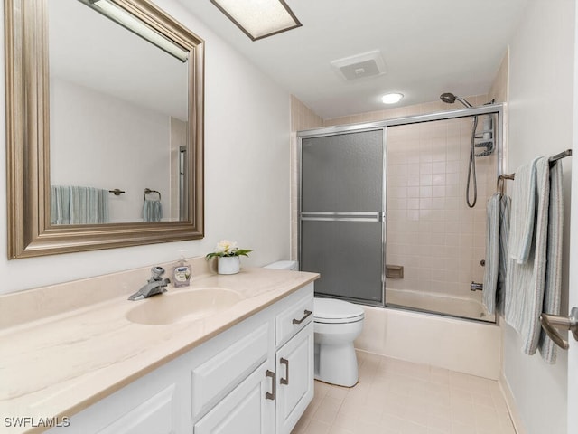 full bathroom with vanity, enclosed tub / shower combo, and toilet