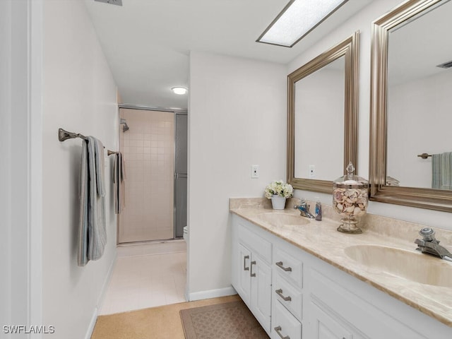 bathroom with walk in shower, tile patterned floors, vanity, and toilet