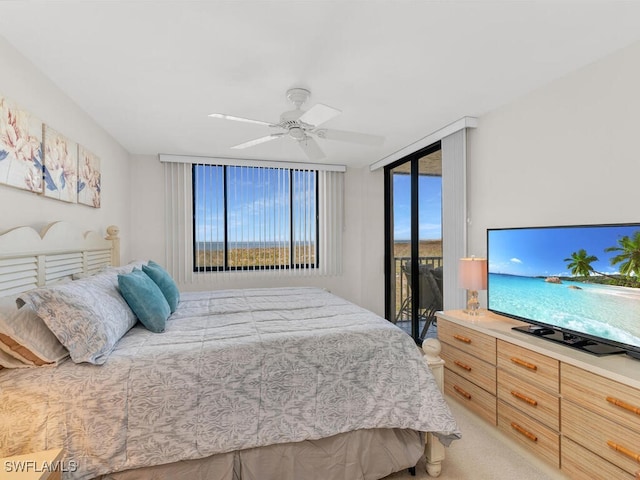 bedroom featuring ceiling fan, access to exterior, and light carpet