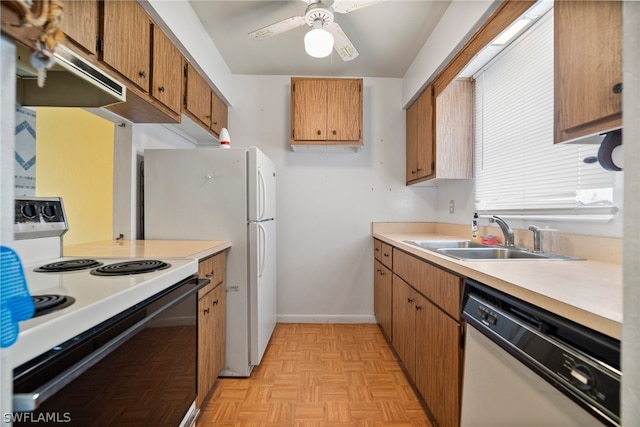 kitchen with white appliances, sink, ceiling fan, and light parquet flooring