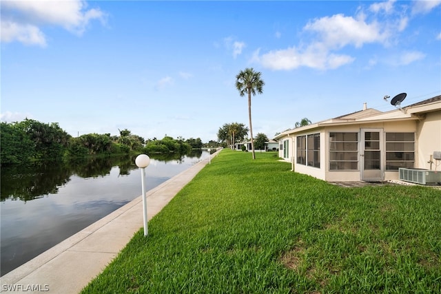 exterior space with a water view and central air condition unit