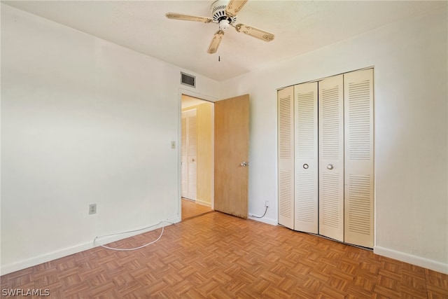 unfurnished bedroom with ceiling fan and light parquet floors