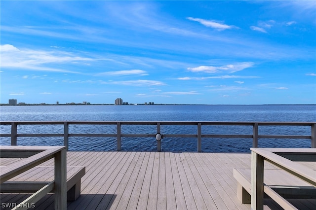 dock area featuring a deck with water view