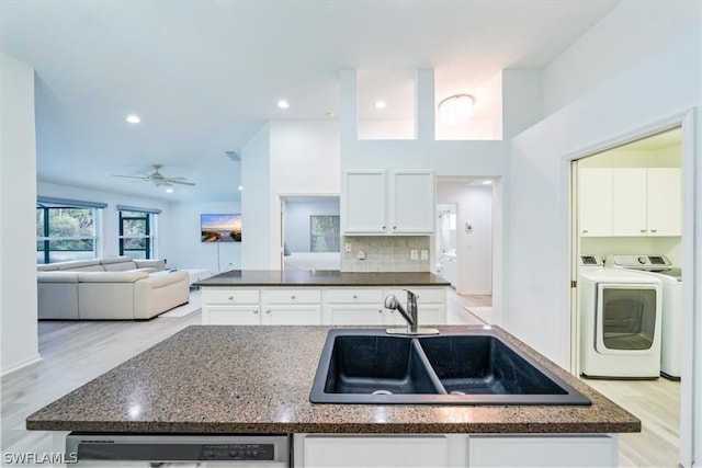 kitchen featuring light hardwood / wood-style flooring, ceiling fan, tasteful backsplash, white cabinetry, and sink