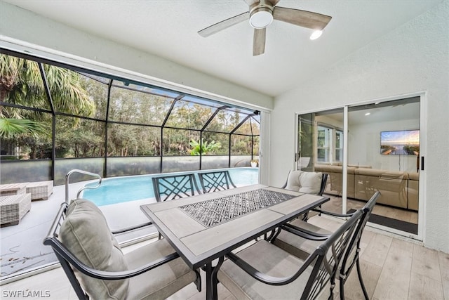 view of swimming pool with ceiling fan