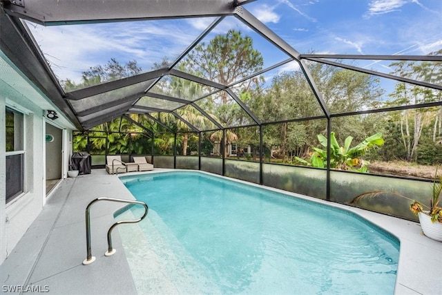 view of pool featuring a lanai and a patio area