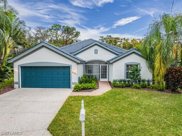 ranch-style home with a front yard and a garage