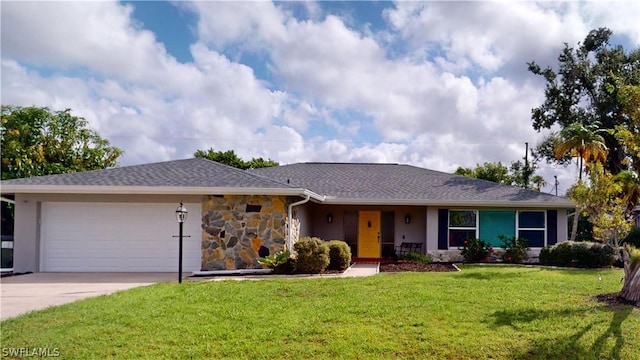 ranch-style home with a front yard and a garage