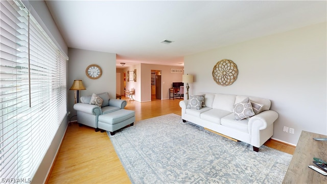 living room with light hardwood / wood-style flooring