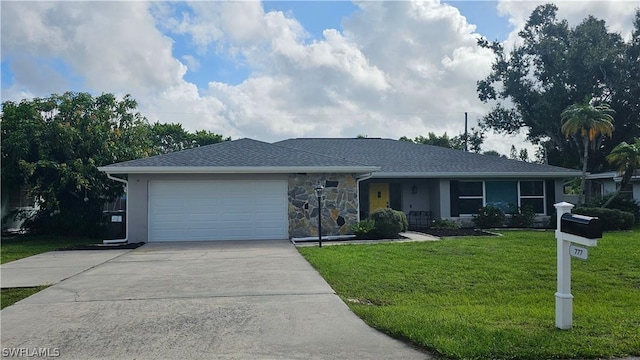 ranch-style house with a garage and a front lawn