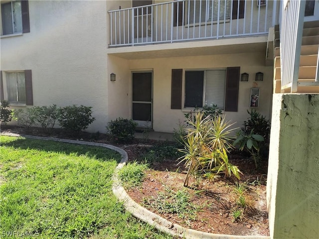 entrance to property with a balcony