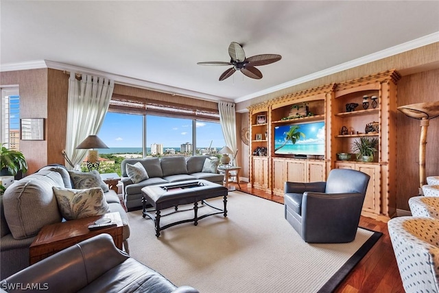 living room featuring ceiling fan and ornamental molding