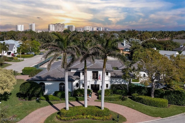 view of community featuring a view of city and decorative driveway