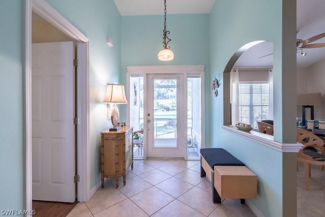 tiled entrance foyer featuring ceiling fan