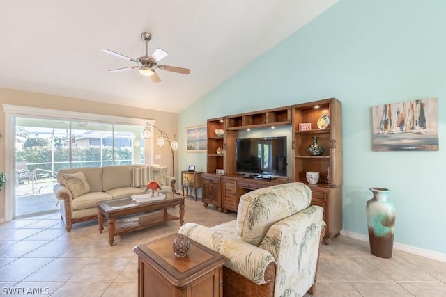 tiled living room featuring ceiling fan and high vaulted ceiling