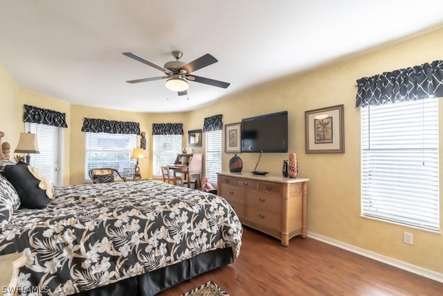 bedroom featuring dark hardwood / wood-style floors and ceiling fan