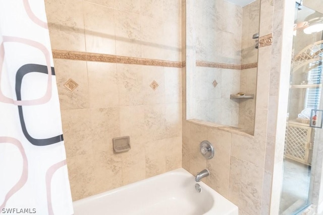 bathroom with tiled shower / bath combo