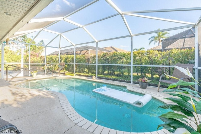 view of pool featuring a lanai and a patio area