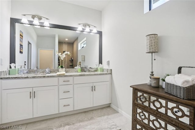 bathroom with vanity, tile patterned floors, and plenty of natural light