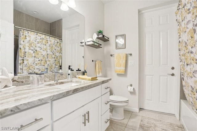 full bathroom featuring tile patterned floors, vanity, toilet, and shower / tub combo