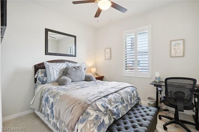 bedroom featuring ceiling fan and light colored carpet