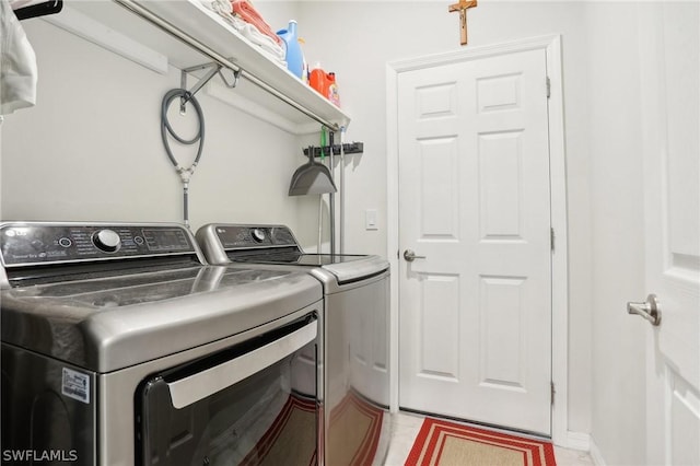 laundry room with washer and clothes dryer