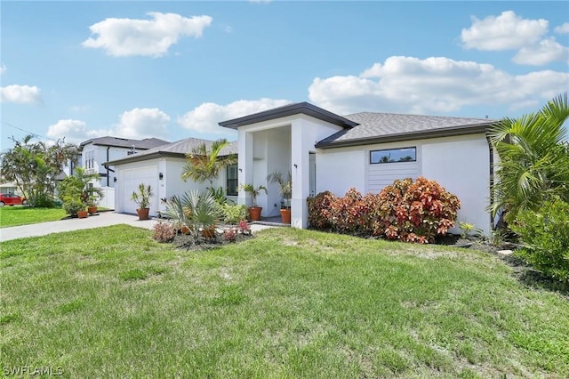 view of front facade with a front yard and a garage