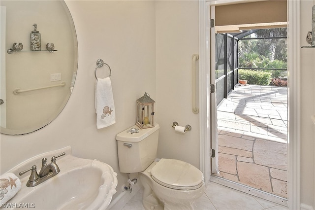 bathroom with tile patterned floors, toilet, and sink