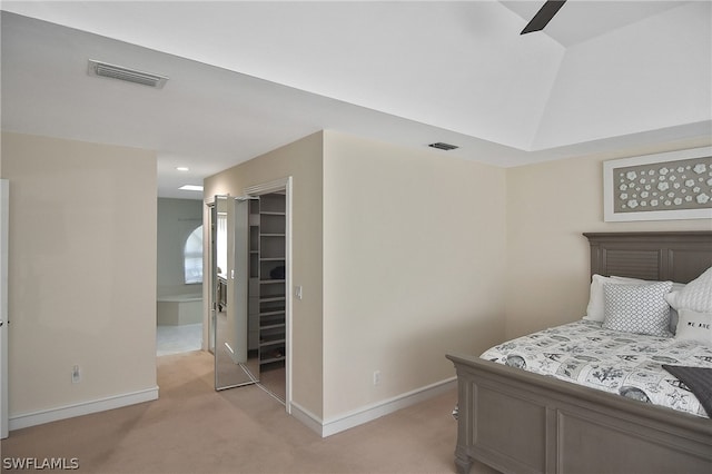 bedroom with ceiling fan, a closet, and light colored carpet