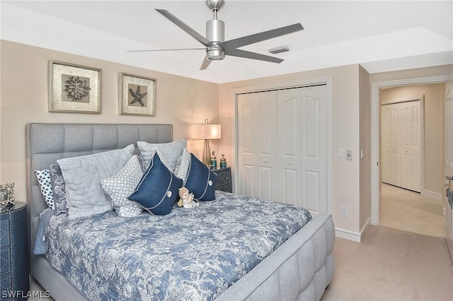 bedroom with light carpet, a closet, and ceiling fan