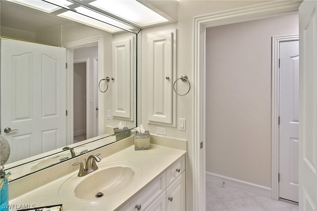 bathroom featuring tile patterned flooring and vanity