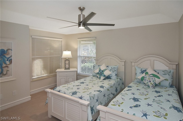 bedroom featuring light colored carpet and ceiling fan