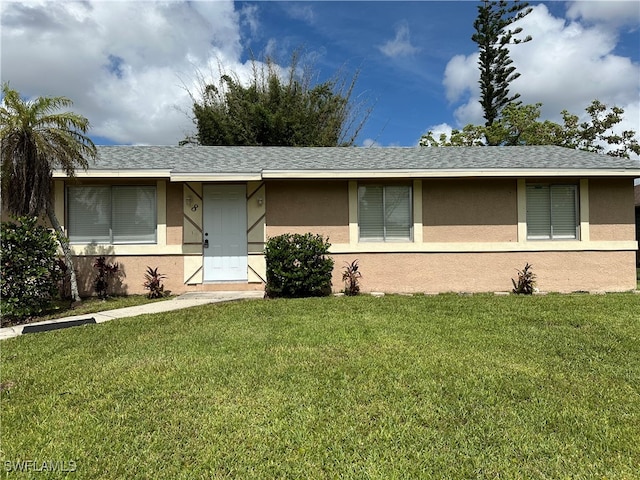 single story home with a front yard