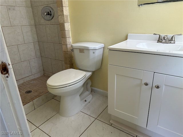 bathroom with vanity, tile patterned flooring, toilet, and curtained shower