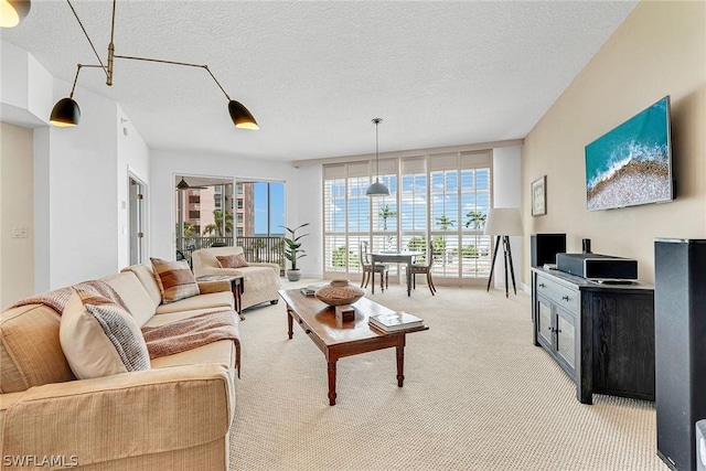 living room featuring a textured ceiling and light carpet