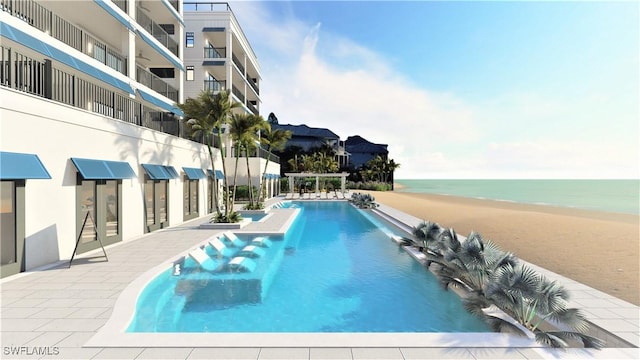 view of swimming pool with a water view and a view of the beach