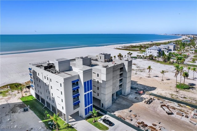 aerial view featuring a view of the beach and a water view