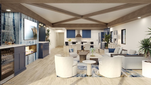 living room featuring vaulted ceiling with beams, bar, light wood-type flooring, and beverage cooler