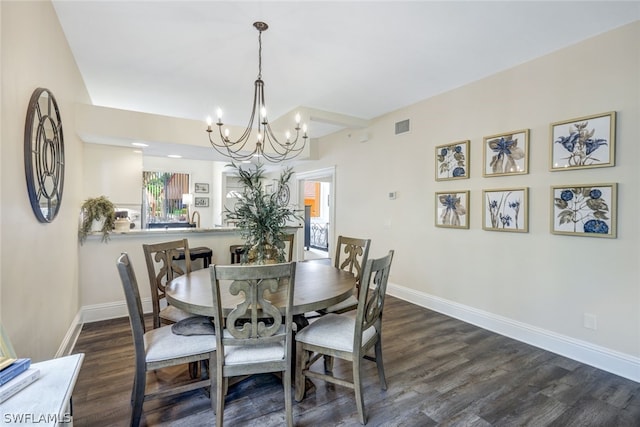 dining room with dark wood-type flooring, visible vents, and baseboards