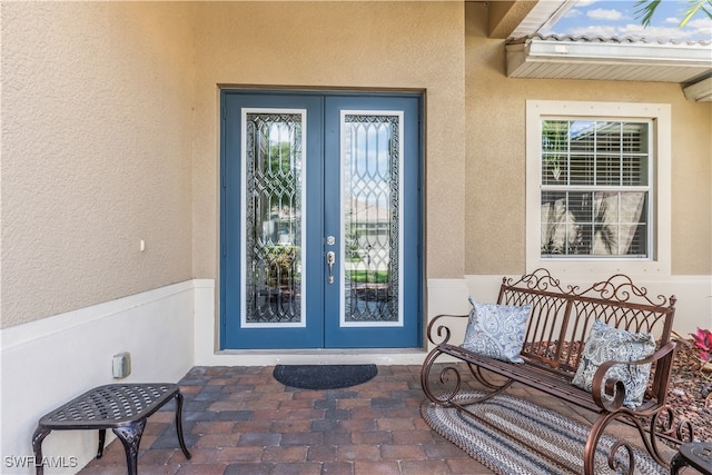 property entrance with french doors and a patio