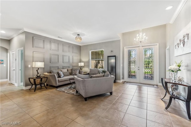 living room with light tile patterned floors, french doors, a notable chandelier, and ornamental molding