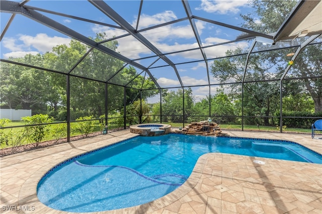 view of swimming pool with glass enclosure, an in ground hot tub, and a patio