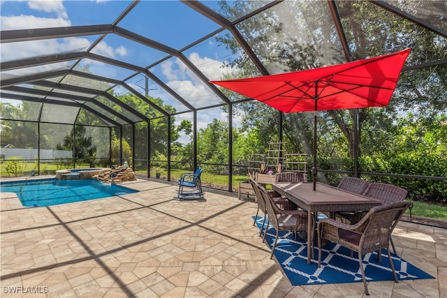 view of patio with glass enclosure and a pool with hot tub