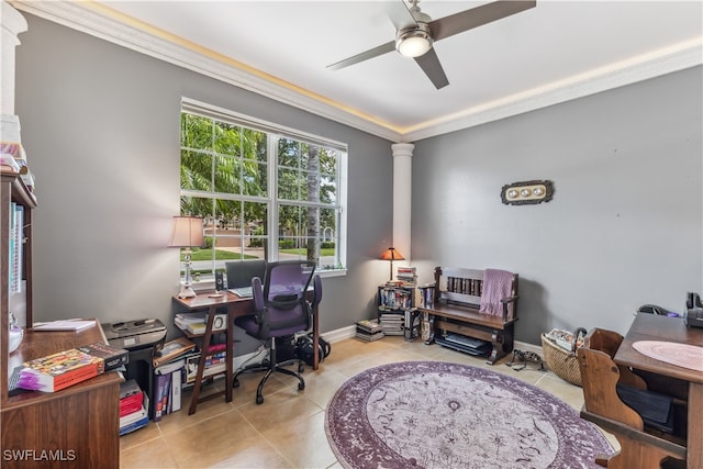 office area with decorative columns, ceiling fan, crown molding, and light tile patterned flooring