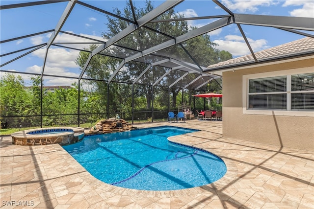 view of swimming pool with a lanai, an in ground hot tub, and a patio