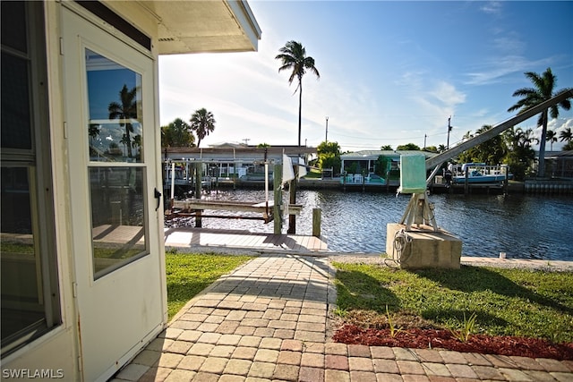 view of dock featuring a water view and boat lift