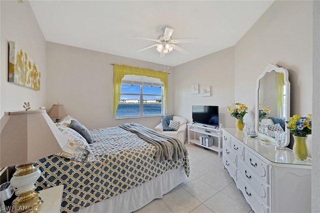 bedroom with ceiling fan and light tile patterned floors