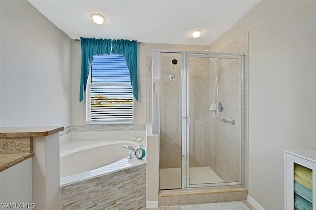 bathroom featuring tile patterned floors, vanity, and plus walk in shower